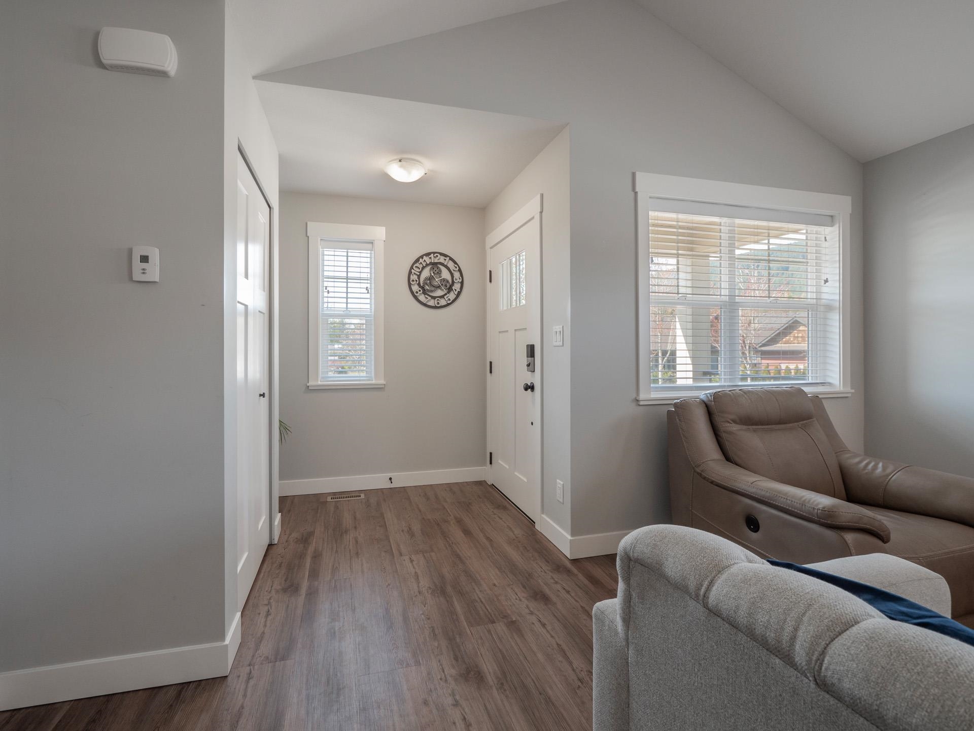 With coat closet, spot for a small bench and continuous flooring again throughout this open plan rancher.