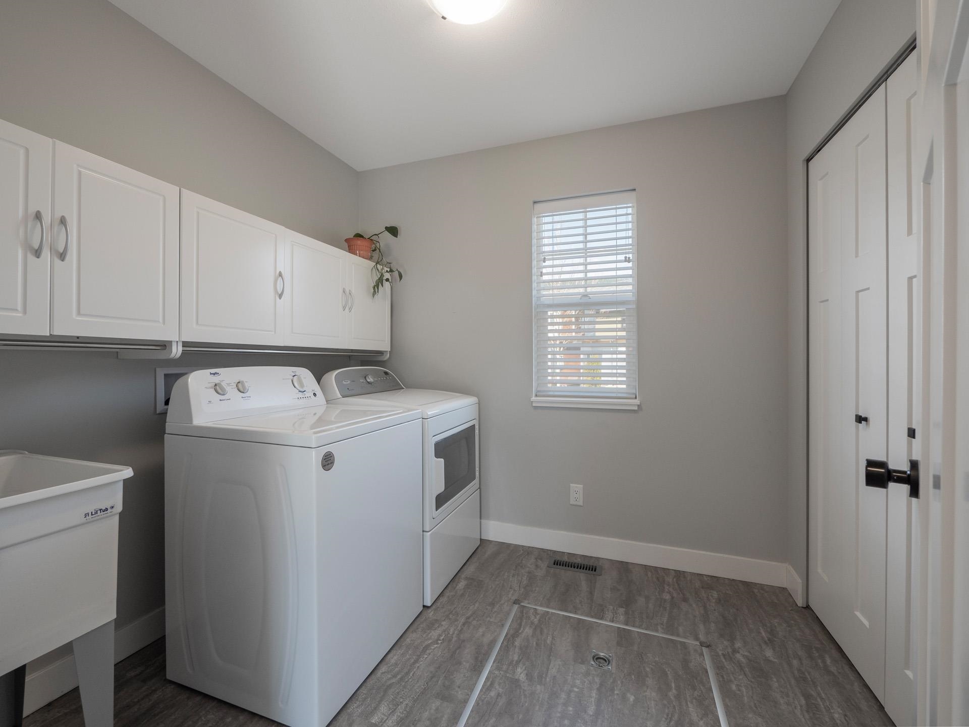 With laundry sink and access to the large, usable for storage crawl space!