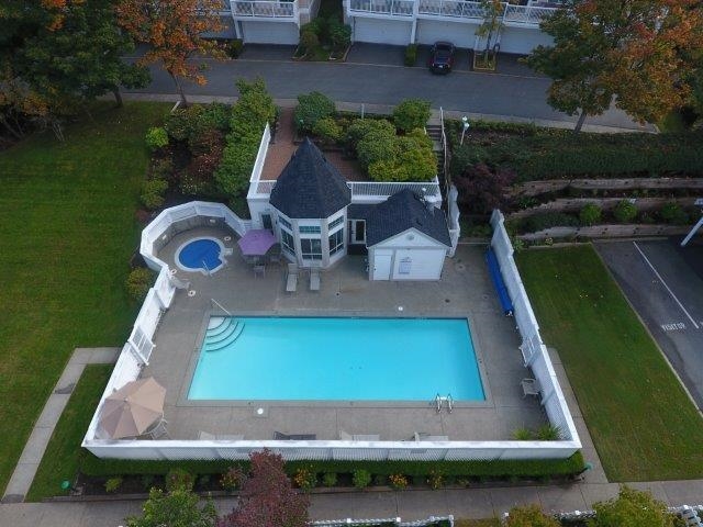 Aerial view of pool, hot tub and fitness centre.  Separate car wash to the right