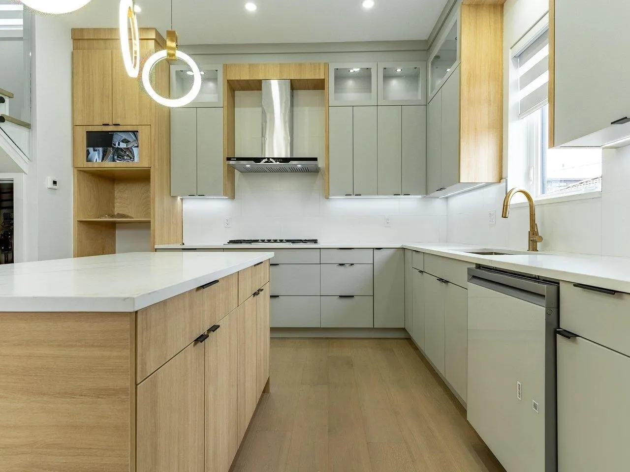 KITCHEN ISLAND IS REPOSITIONED PARALLEL TO STOVE, APPLIANCES ARE INSTALLED