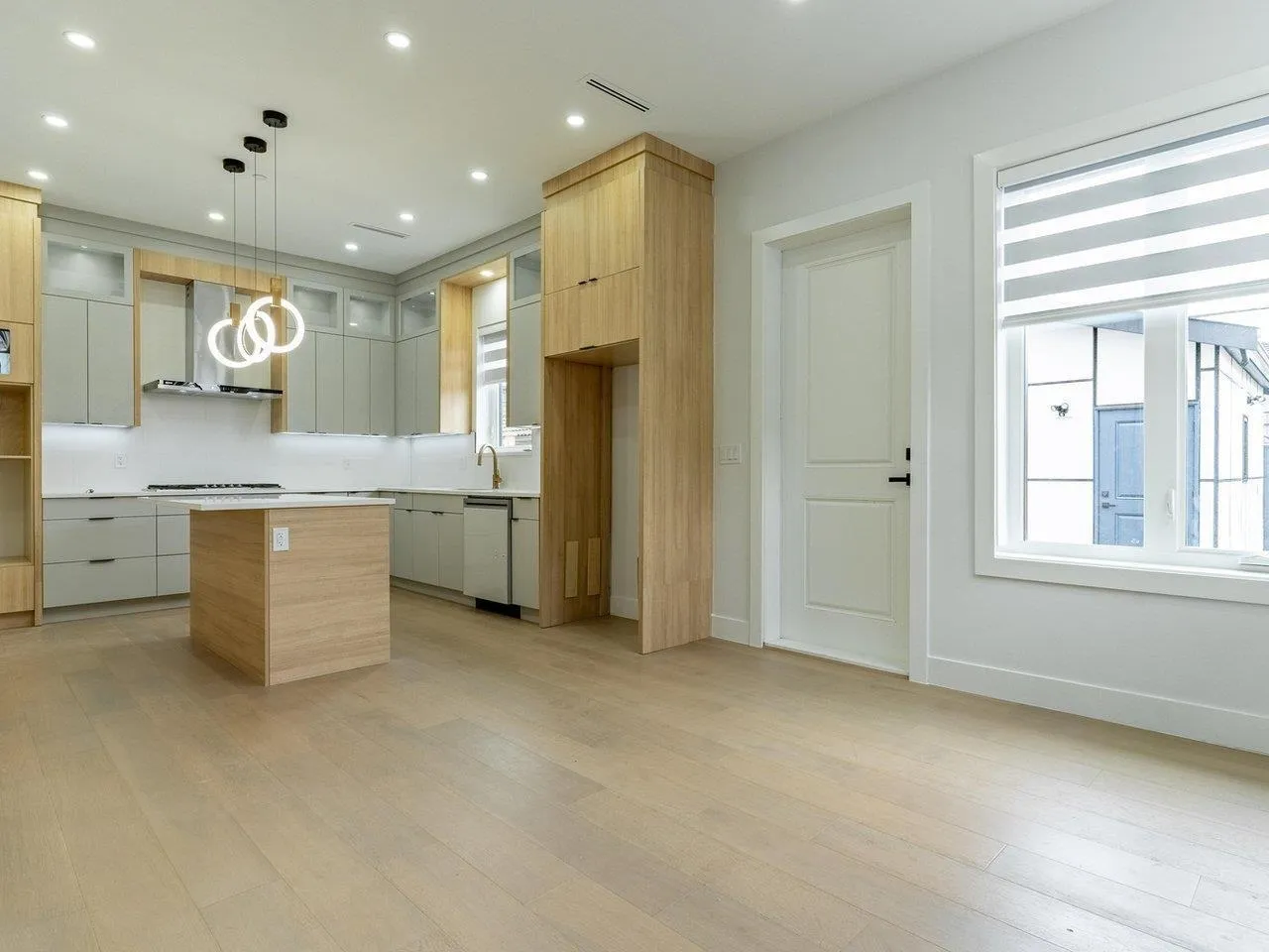 KITCHEN ISLAND IS REPOSITIONED PARALLEL TO STOVE, APPLIANCES ARE INSTALLED