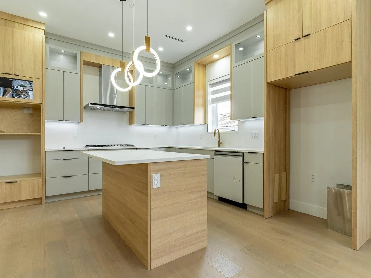 KITCHEN ISLAND IS REPOSITIONED PARALLEL TO STOVE, APPLIANCES ARE INSTALLED