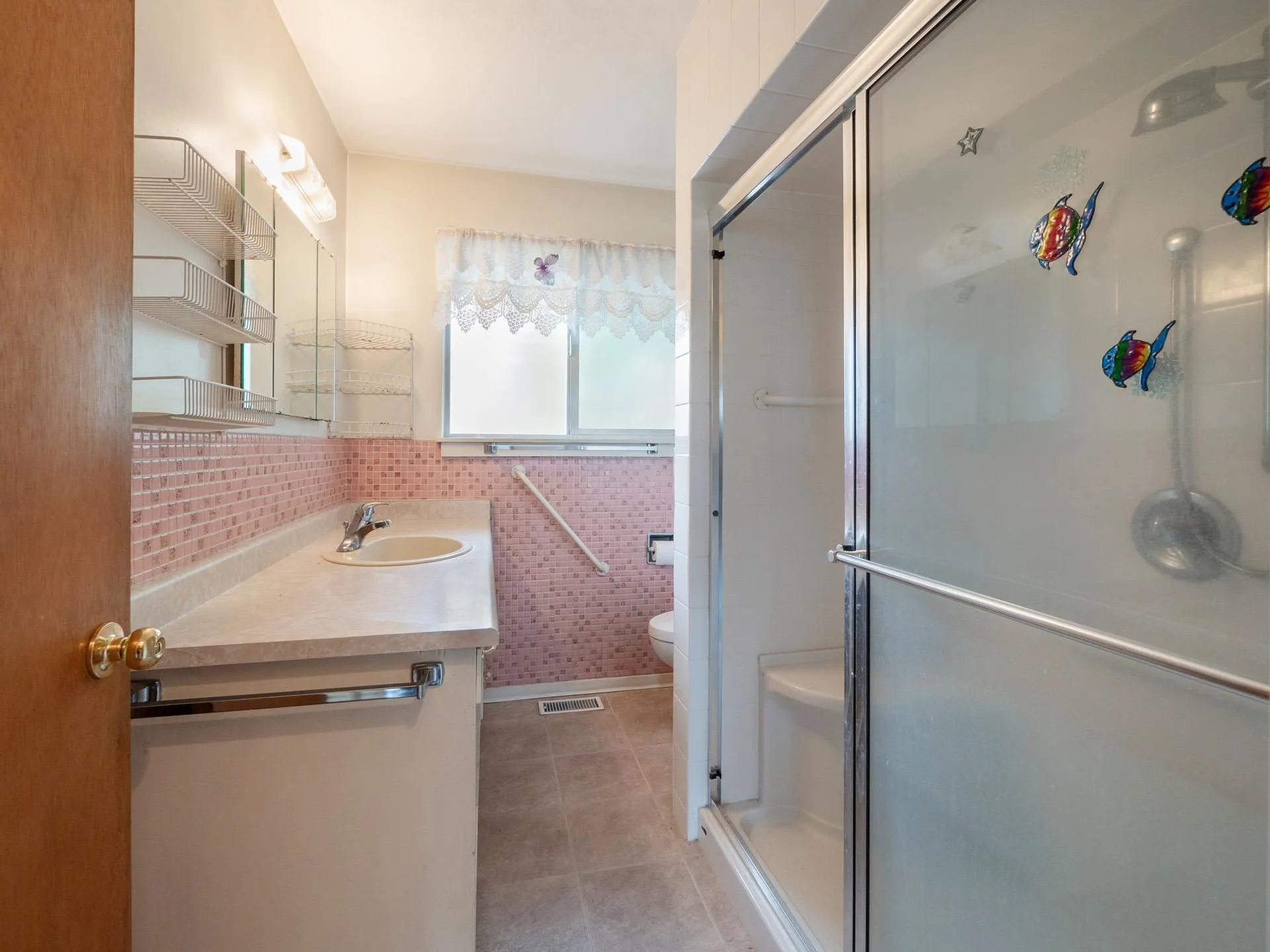 Features retro pink tile (I love it!), double sized shower and window for good ventilation.