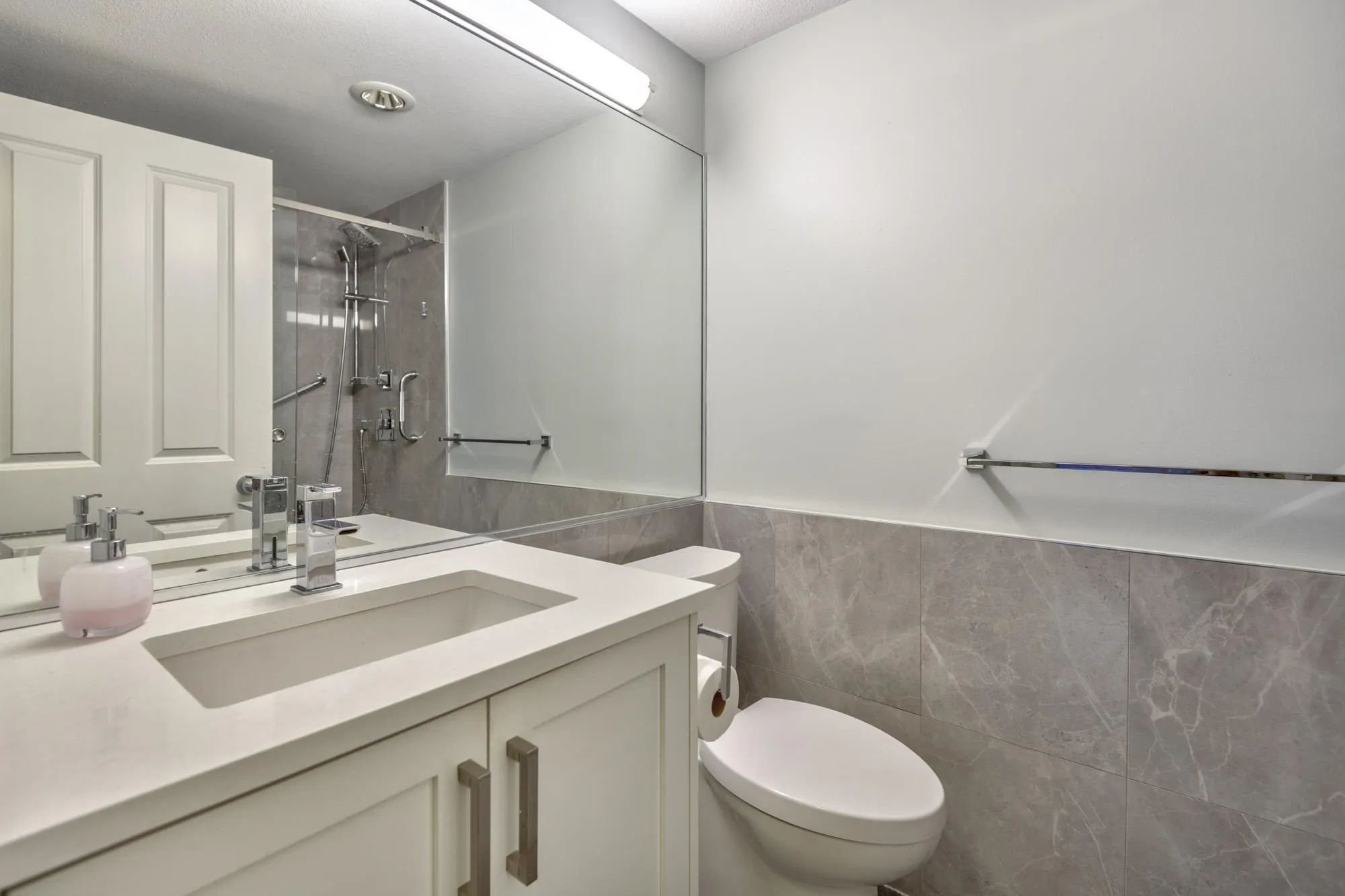 Fully Renovated Bathroom with a Marble Walk-in Shower