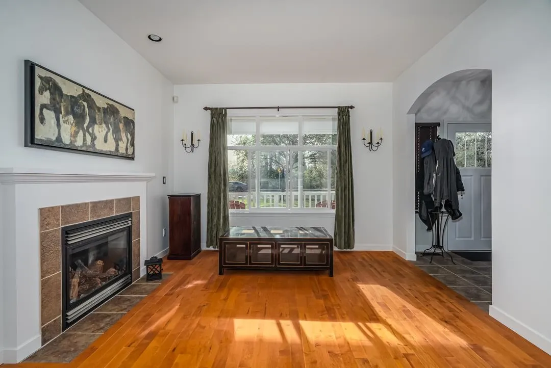 Featuring hardwood floors and gas fireplace.