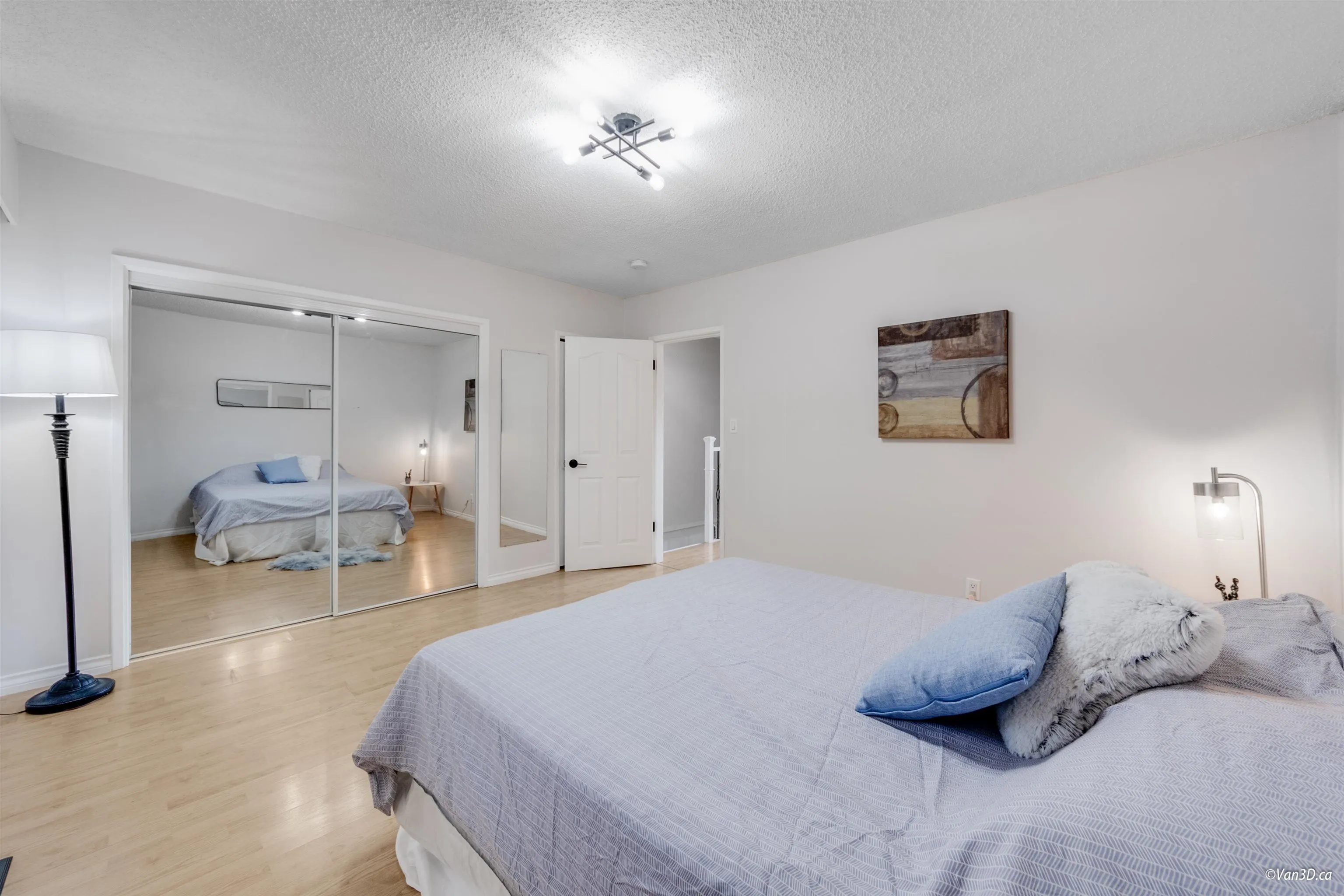 Master Bedroom overlooks fenced backyard & patio.