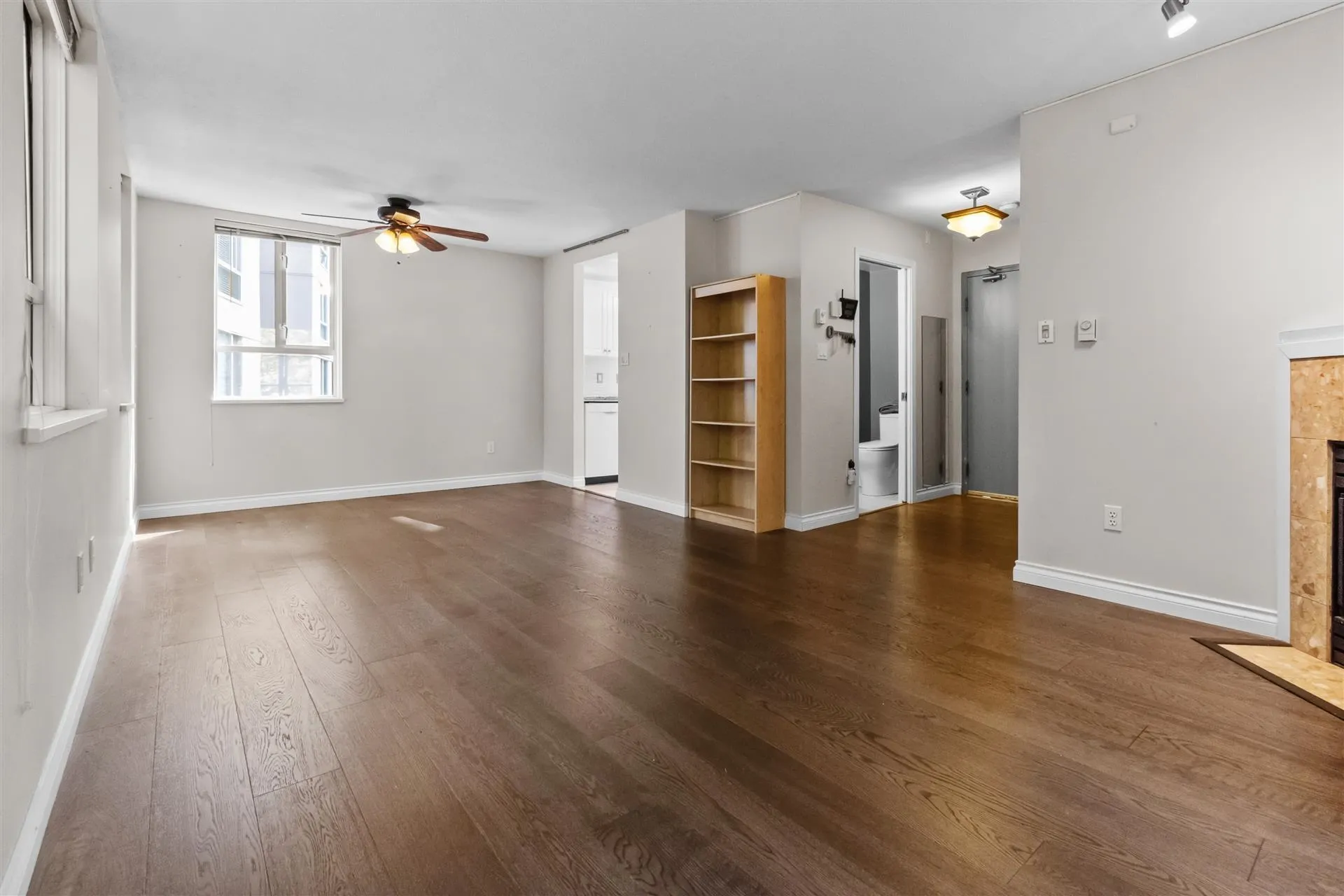 Living and dining room are adjacent to the kitchen and patio