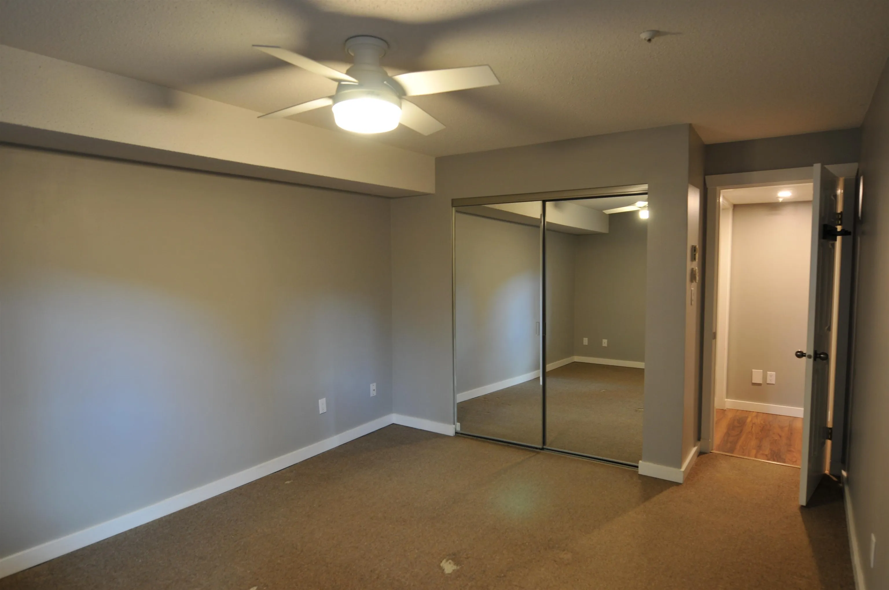 Large closet w/ mirrored sliding doors.