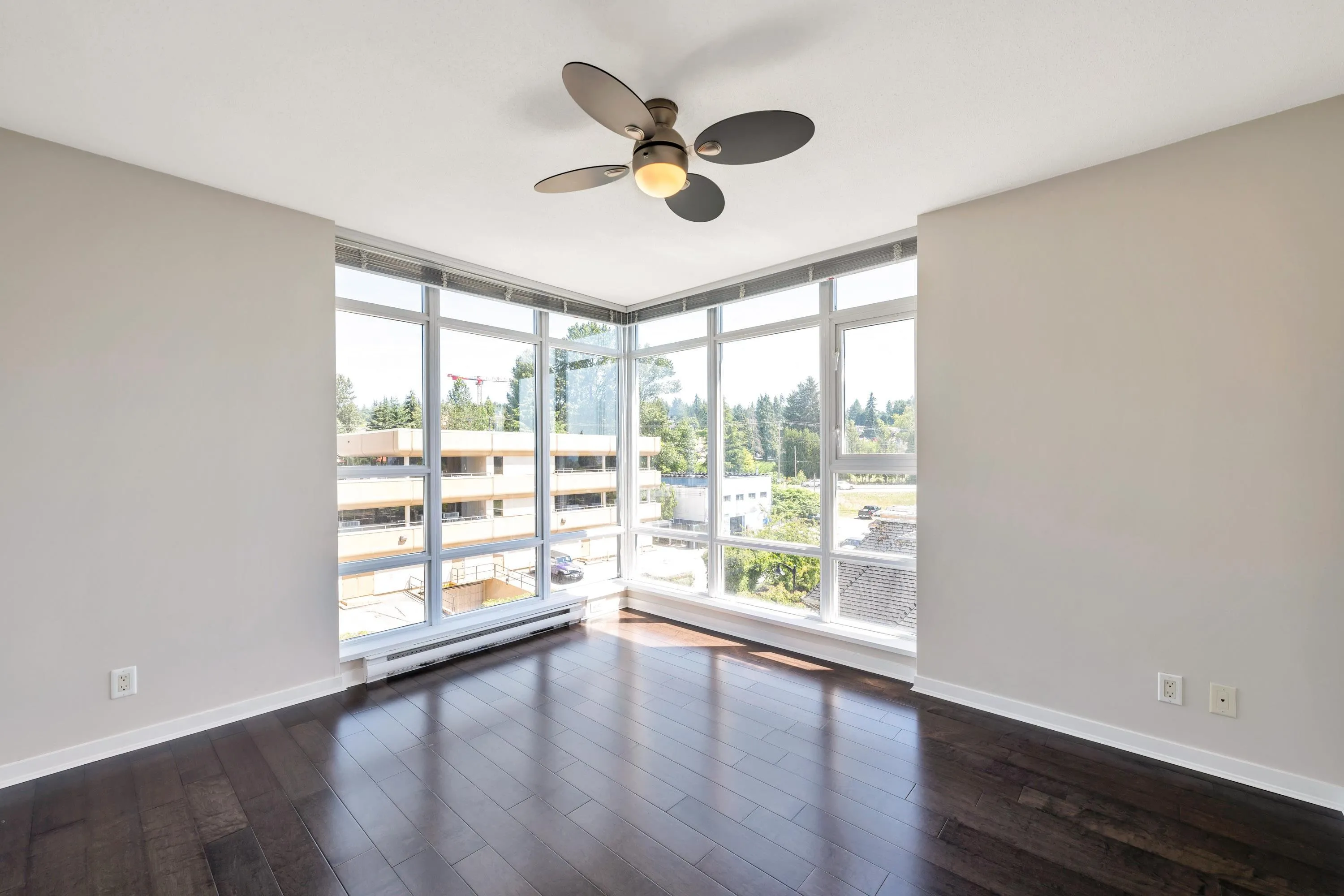 Floor to ceiling corner windows, an overhead fan and good sized closet-check out the virtually staged photos of this bedroom for some great ideas to maximize this space.