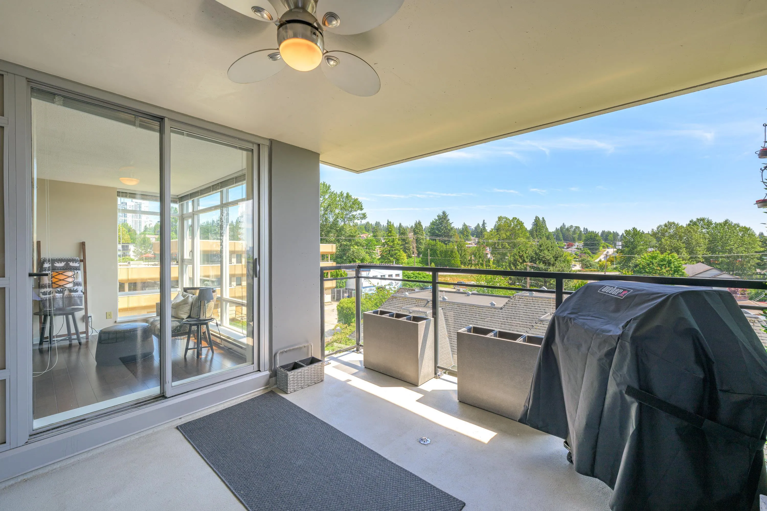 The spacious and covered balcony is the perfect place to enjoy year round grilling, entertaining and relaxing. Rain, snow or sunshine-this outdoor space has you covered!