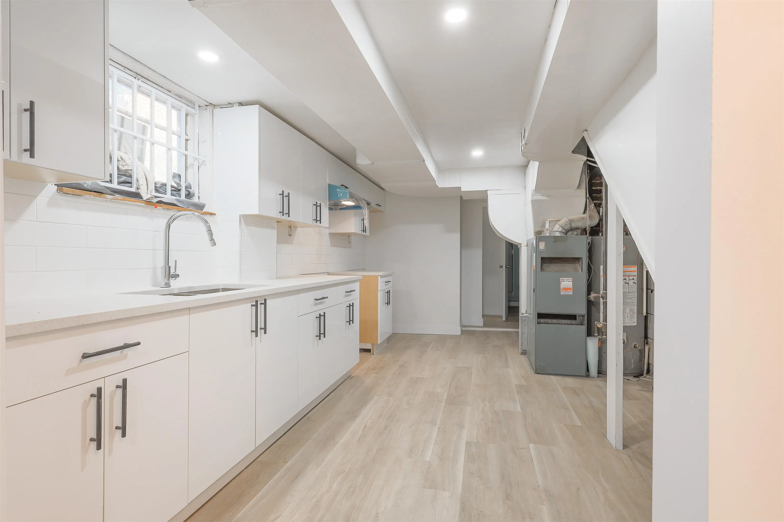 Photo before appliances arrived. Fridge and Stovetop included