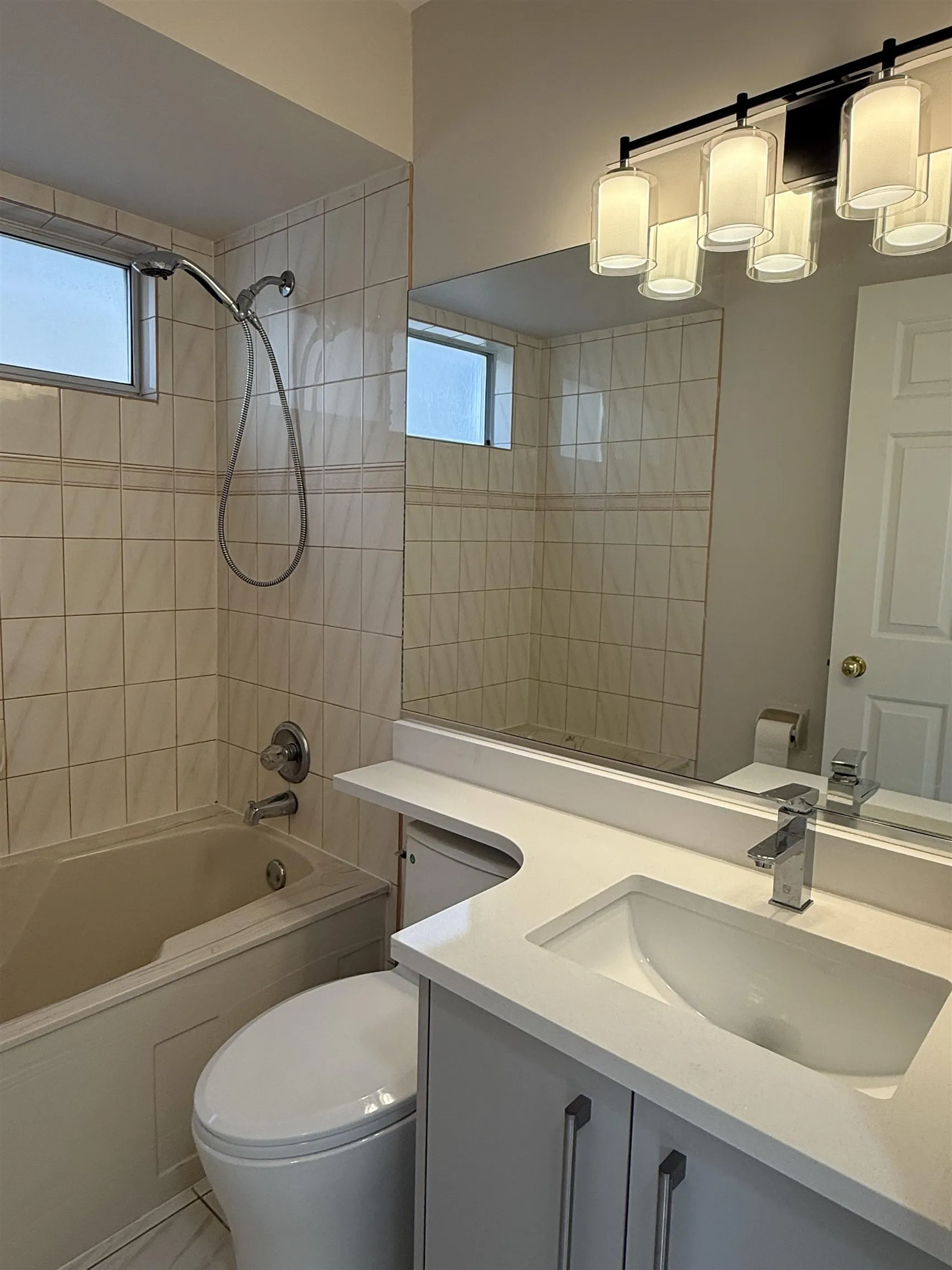 Full bathroom on main floor.  Features new toilet, new sink, faucet, cabinet and counter top.